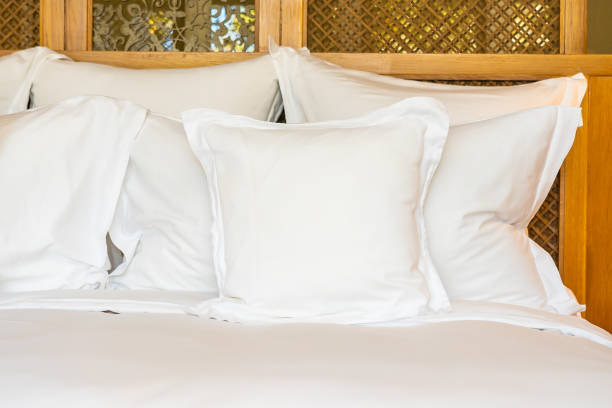 istock Comfortable white pillow on bed decoration in bedroom 1208089396