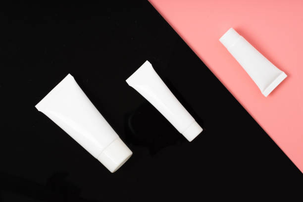 istock white realistic glossy cosmetic tubes on back and pink 1208089450