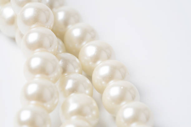 istock pearl necklace isolated on white blackground 1208089487