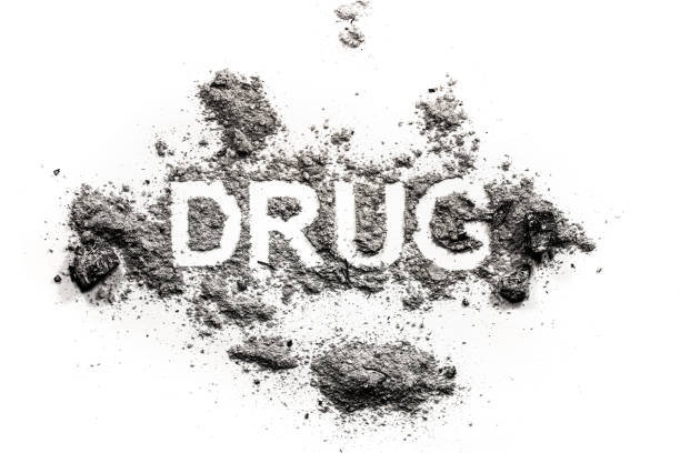 istock Drug word written in ash, dust, dirt as narcotic problem 1208090341