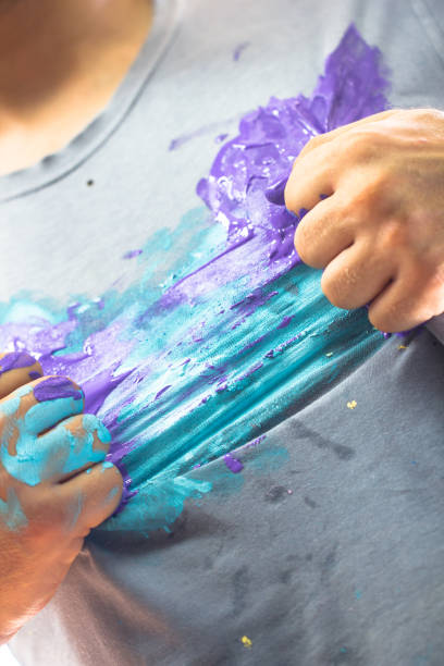 istock Shirt and hand dirty with paint in a dramatic superhero pose as handmade creative artistic hero 1208091232