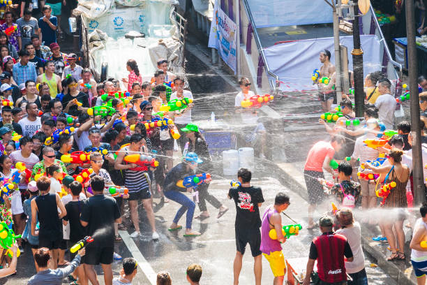 Songkran Festival in Silom, Bangkok, Thailand Bangkok, Thailand - April 13: Famous Songkran Festival in Silom on April 13, 2019. One of the most popular water fight places during Songkran in Bangkok, Thailand. silom stock pictures, royalty-free photos & images