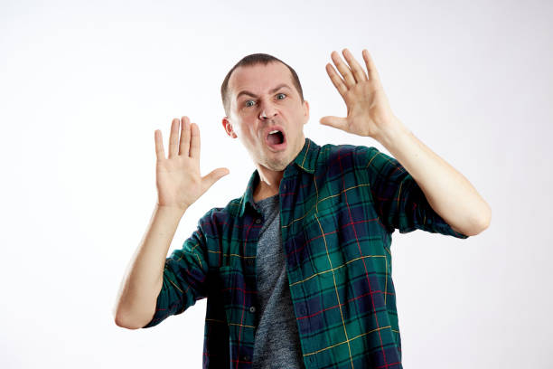 istock Fear and fright of a man. Guy is afraid, scared face 1208097931