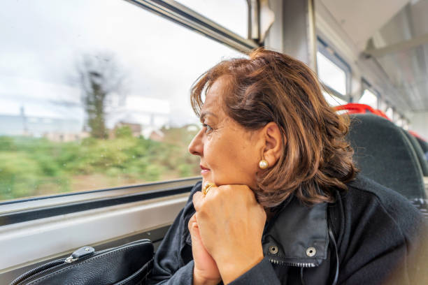 istock Senior Hispanic woman on train 1208098188