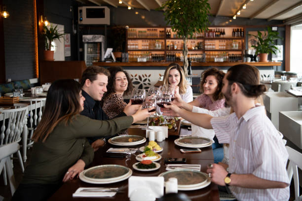istock Red wine celebratory toast in restaurant 1208100582