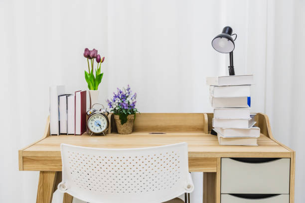istock A wooden table for reading in a clean white room. 1208106100