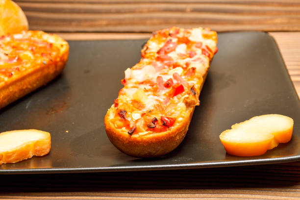 istock Italian bruschetta with roasted tomatoes, mozzarella cheese and herbs 1208110147