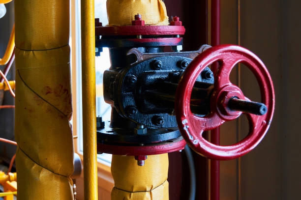 istock Black valve on the yellow heating pipe. 1208112998