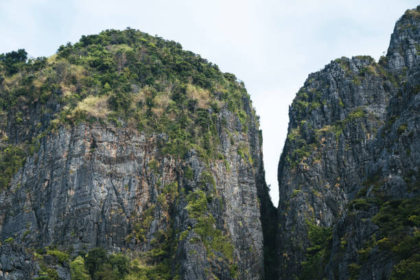 Limestone mountains are a common sight at the Phi Phi Islands in the Krabi province of Thailand. Seen a hot summer day.