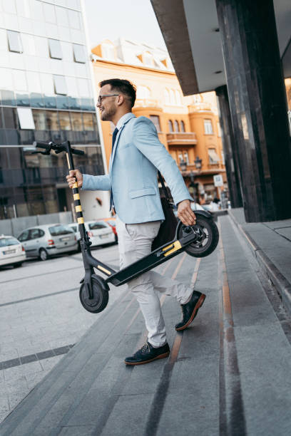 istock Modern man with electric scooter 1208114994