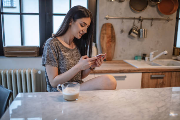 istock Young woman drinking morning coffee 1208115025
