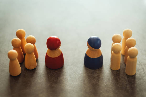 istock Two different groups of people standing facing to each other 1208115079