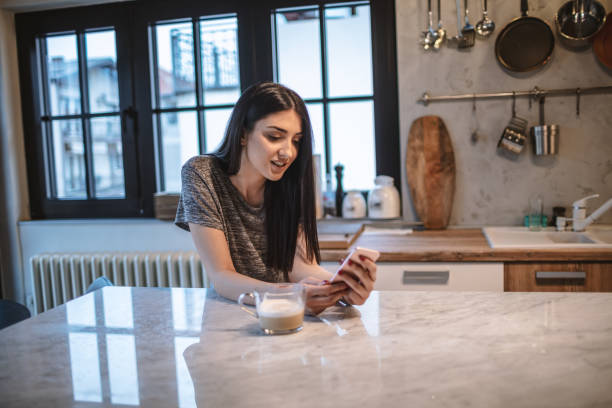istock Young woman drinking morning coffee 1208115083