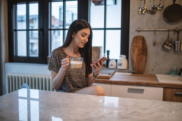 istock Young woman drinking morning coffee 1208115244