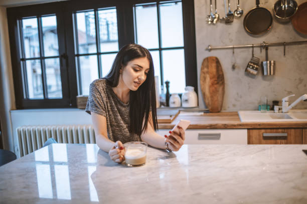 istock Young woman drinking morning coffee 1208115360