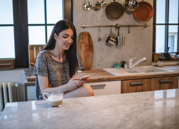 istock Young woman drinking morning coffee 1208115387