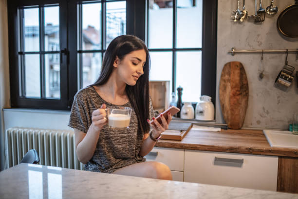 istock Young woman drinking morning coffee 1208115532