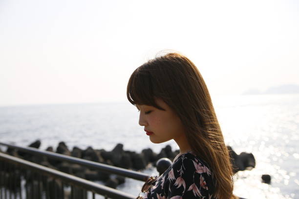 istock woman with a cute smile 1208115746