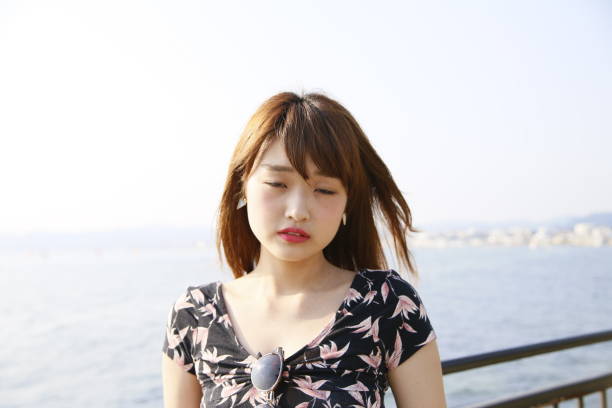 istock woman with a cute smile 1208116446