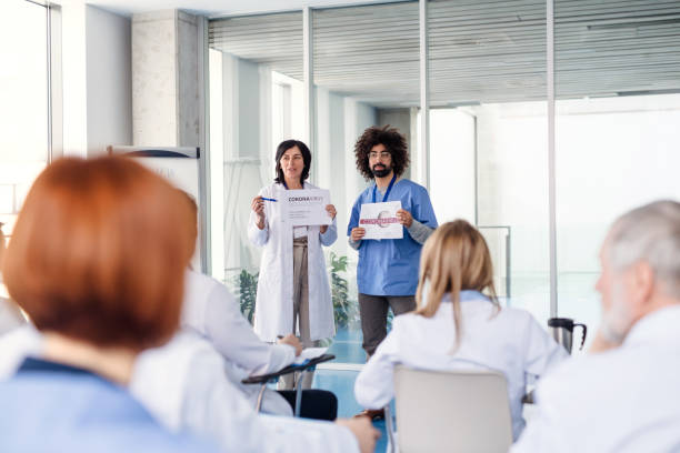 istock Group of doctors talking about corona virus on conference. 1208116531