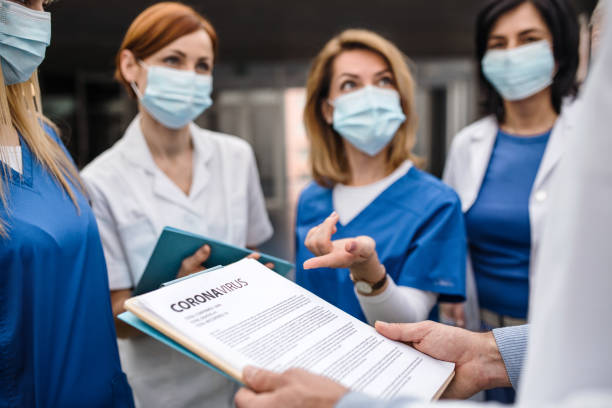istock Group of doctors talking about corona virus on conference. 1208116602