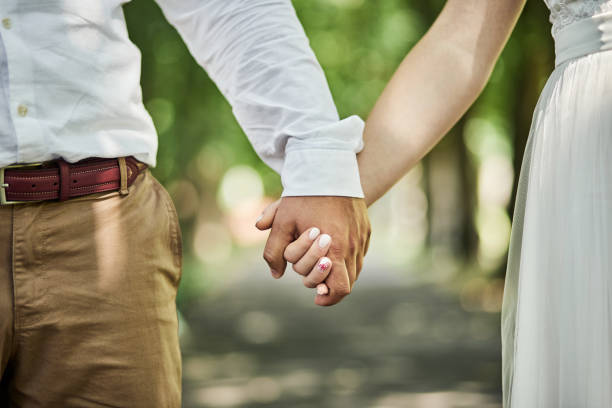 istock loving couple holding hands 1208116631