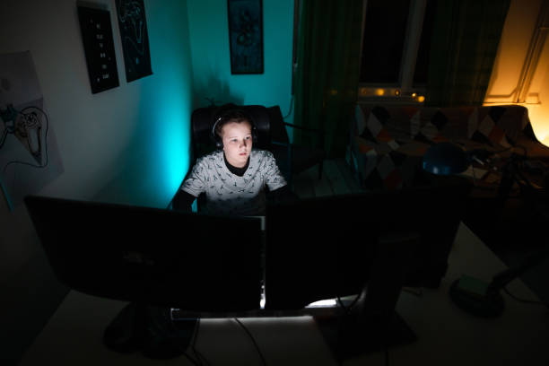 istock He is so concentrated on playing video games that he didin't notice how late it is 1208117510