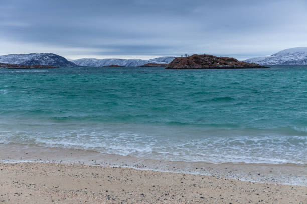 beautiful view over sand beach and fjord. Sommaroy, Norway. Winter. Polar night. long shutter speed