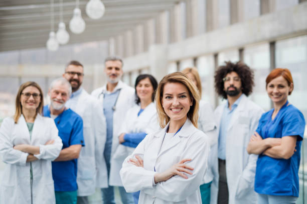 istock Group of doctors looking at camera, corona virus concept. 1208118419