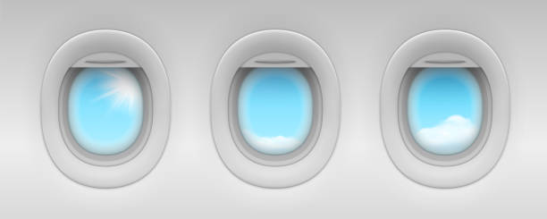 istock Blue sky and cloud behind airplane portholes. Realistic aircraft or jet, plane windows isolated. Indoor view on passenger illuminator. Passenger cabin indoor or inside view. Flying trip and cloudscape 1208119244