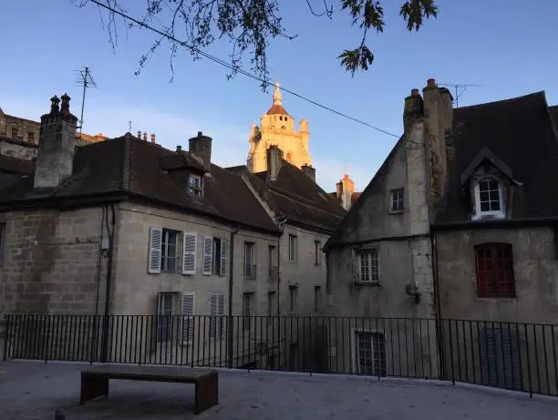 Photo of The Notre-Dame de Dole church and the old town seen from Place aux fleurs square in Dole, France