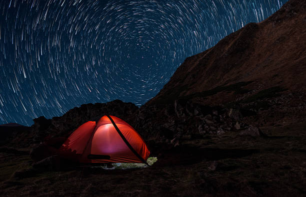 istock lonely tent under the stars in mountains 1208126467