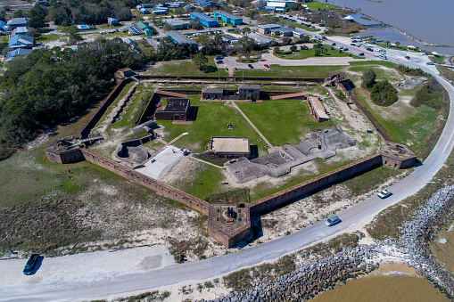 Aerial views of a harbor, Fort Gaines and a bird sanctuary on Dauphin Island, Alabama in February 2020