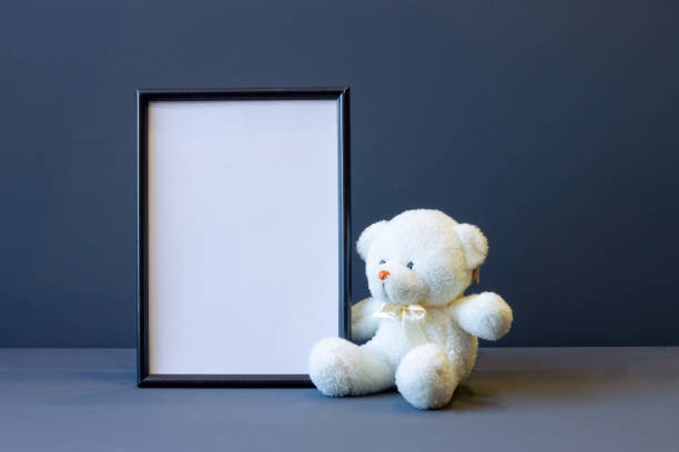 istock black photo frame and soft toy on a gray background copy space 1208130554