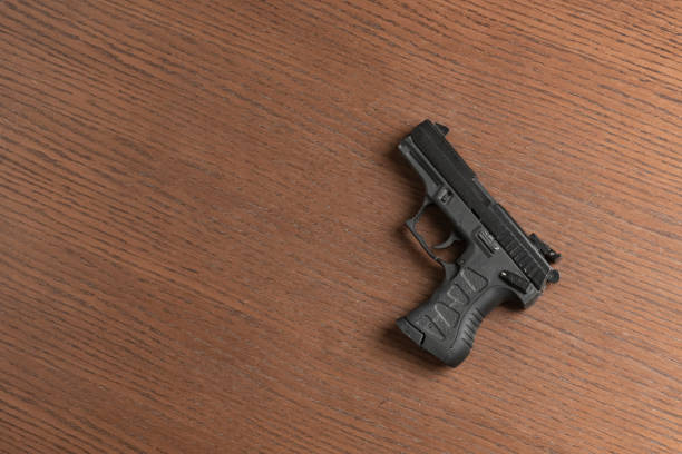 istock a black 9mm modern fire gun pistol of cop isolated 1208132930