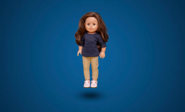 a simple abstract toy doll isolated on the color background with copy space, float in air