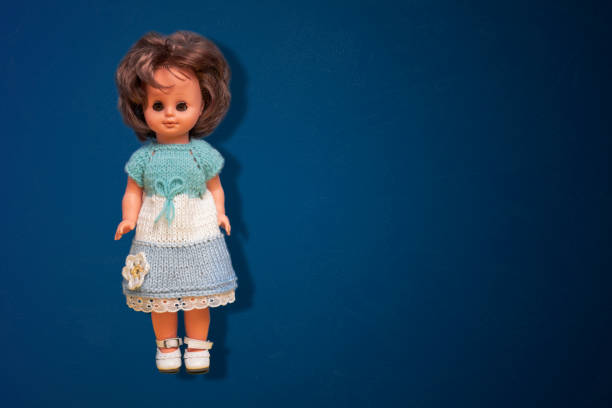 a simple abstract toy doll isolated on the color background with copy space, float in air
