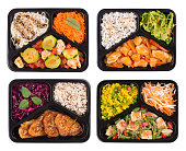Set of containers with healthy cooked lunch isoalted on white background