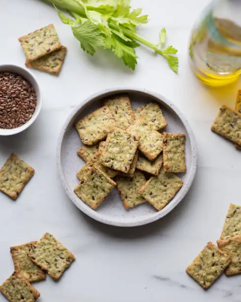 Healthy Snack from Wholegrain Rye Crispbread Crackers with spinach and flaxseed and olive oil