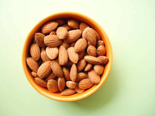 istock almonds in the bowl, top view 1208139808