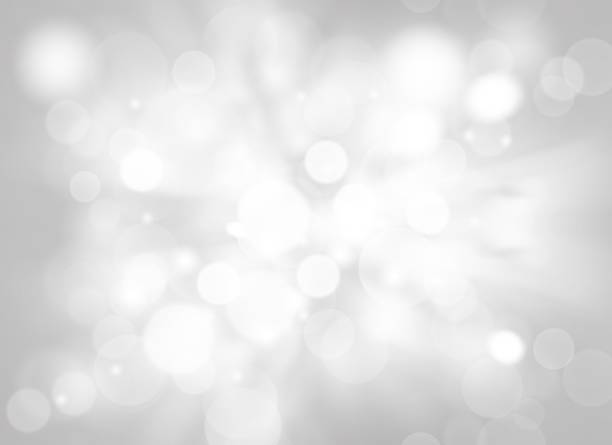istock Gray abstract texture background with white bokeh light Christmas new year snowflake blurred beautiful shiny lights use wallpaper backdrop and your product. 1208140041