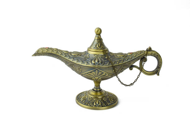 istock Antique golden colored oil lamp with rust displayed over an isolated white background 1208142986