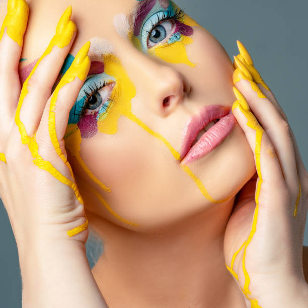 istock Beautiful woman with colorful make-up 1208144361