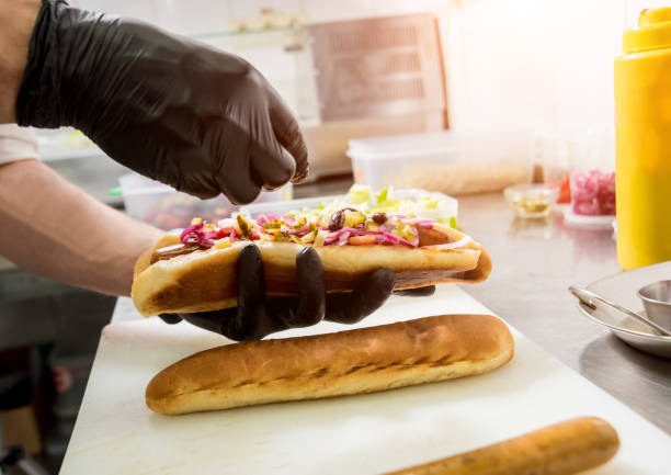 istock The chef cooking hot dog on a grill. Restaurant. 1208149831