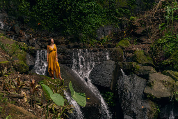 istock Relaxed international woman standing on big stone 1208150117