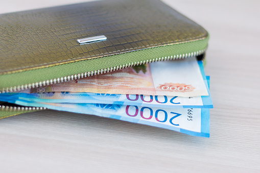 EUR banknotes in a leather wallet