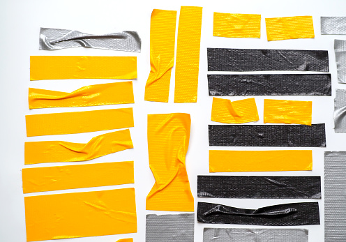 Conjunto de banderas de color gris negro amarillo escocés cinta- cinta adhesiva cortada sobre fondo blanco. puede utilizar productos de papeleo de negocios-banner photo