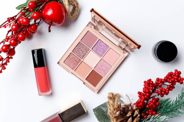 istock Set of professional elite decorative cosmetics for make-up on a white background with Christmas decorations. The concept of beauty and fashion. Fashion blog design. Top view. Flat lay 1208153169