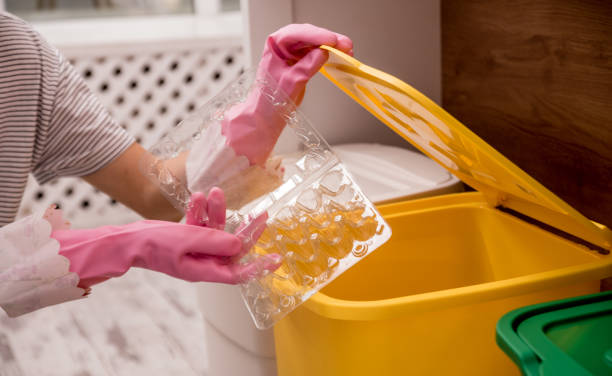 istock Young girl sorting garbage at the kitchen. Concept of recycling. Zero waste 1208153261