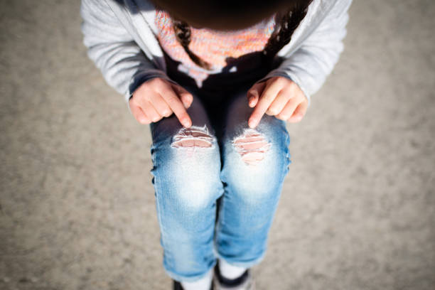 istock Child knee portion of jeans is broken 1208154230